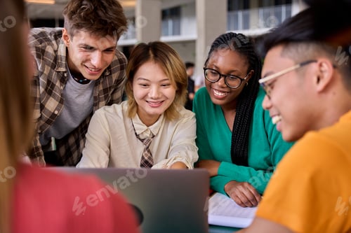 Preview: Happy Young Adults Studying Together with a Laptop