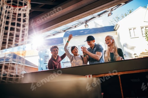 Preview: Friends playing basketball game at amusement park