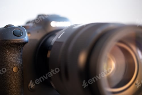 Preview: Close up photo button on the body of a professional digital camera.