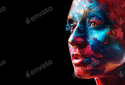 Preview: Shot of an attractive young woman posing alone in the studio with paint on her face