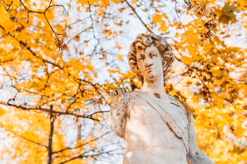 Preview: Antique statue in the park. Autumn landscape, sunny day.