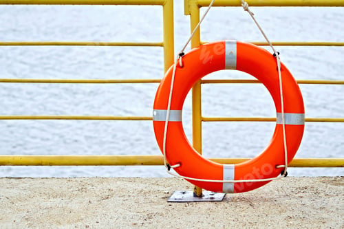 Preview: Lifebuoys red on a fence
