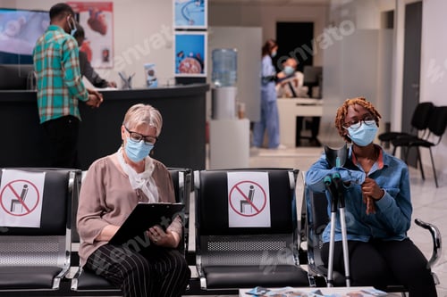 Preview: Female patient with impairment sitting in hospital reception