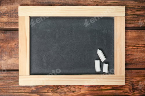 Preview: Empty clean blackboard with chalk on wooden background