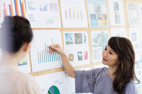 Preview: Colleagues working with colour charts and graphs