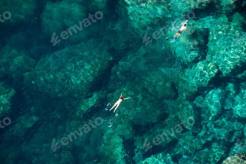 Preview: Drone view of a couple snorkeling in the sea