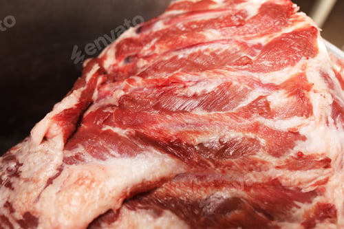 Preview: piece of fresh calf meat. close-up of offal, raw, fresh fleshy animal cut. whole piece of meat.