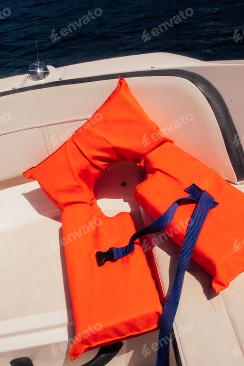 Preview: Orange life vest on boat deck