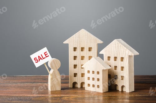 Preview: House Models For Sale on Wooden Table