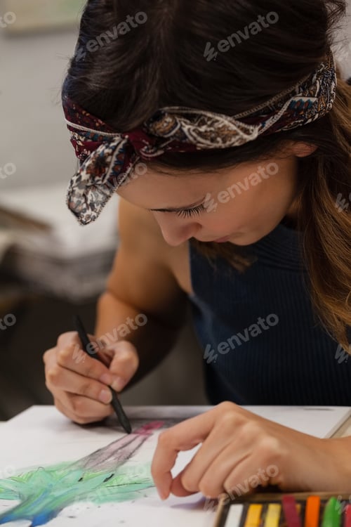 Preview: Woman drawing on book in drawing class