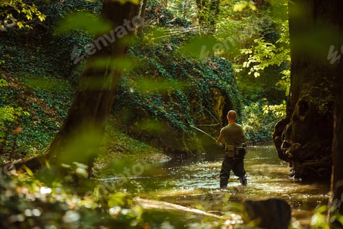 Preview: A fisherman fishing with fly fishing in the flowing stream