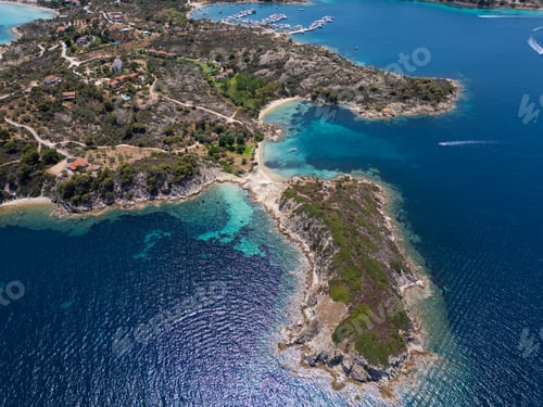 Preview: Aerial view of an island on Sithonia Peninsula, Greece, with beaches and rocks, surrounded by