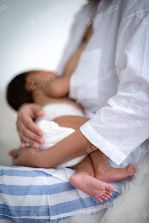 Preview: Adolescent mother is breastfeeding a baby.