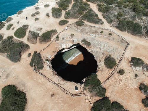 Preview: Framed aerial drone image of the Benagil Caves in Algarve, Portugal