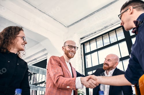 Preview: Business handshake at meeting or negotiation in the office. Partners are satisfied because signing