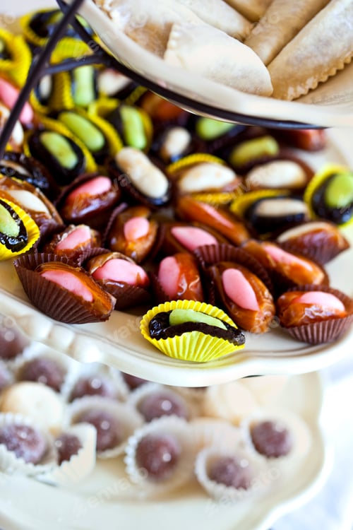 Preview: Various sweets on a porcelain display
v