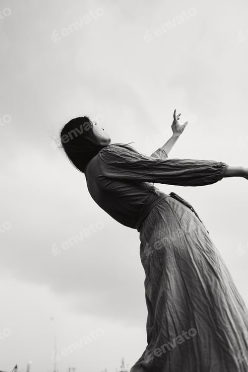 Preview: attractive woman in dress gesturing with hands posing unaltered