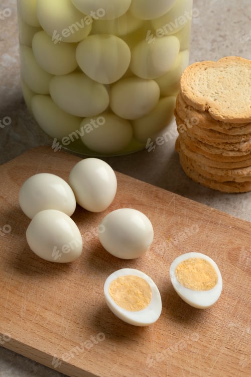 Preview: Cooked whole and sliced Quail eggs close up