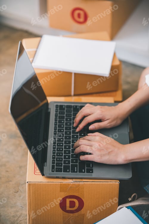 Preview: Small start-up business owners checking parcels at work, freelancers, salespeople, checking producti
