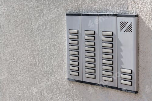 Preview: Intercom station on wall outdoors, space for text. Security system