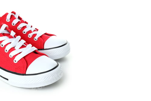 Preview: Pair of red sneakers isolated on white background