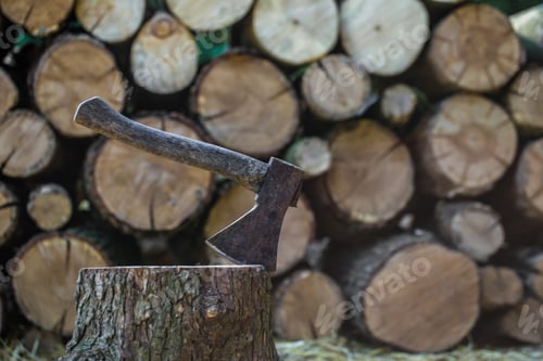 Preview: A deck of stacked logs and an axe