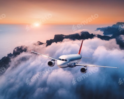 Preview: Passenger airplane is flying over clouds at sunset
