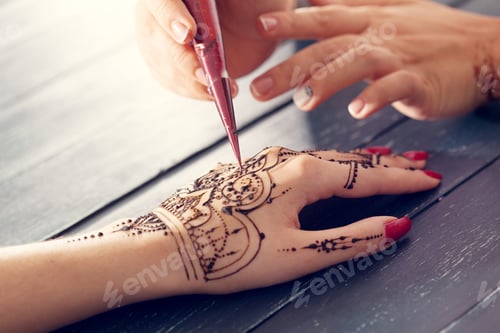 Preview: Process of applying mehndi on female hands