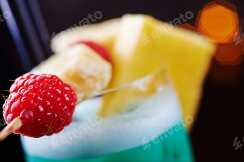 Preview: bright beautiful glass of alcoholic cocktail or lemonade on a table in a bar. soft focus.