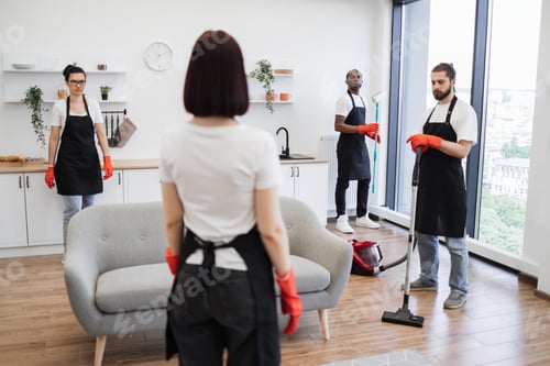 Preview: Team Cleaning Apartment with Vacuum and Equipment