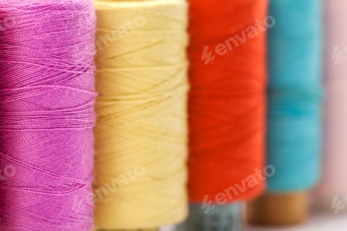 Preview: Reels or spools of multicolored sewing threads. Threads of all colors.