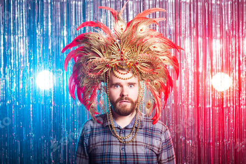 Preview: Fun, holiday and april fools day people concept - Strange man with carnival mask and hat