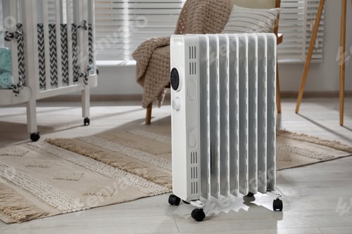 Preview: Modern portable electric heater in child room, space for text