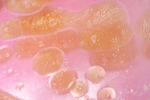 Preview: abstract pink and orange background formed by oil drops on water
