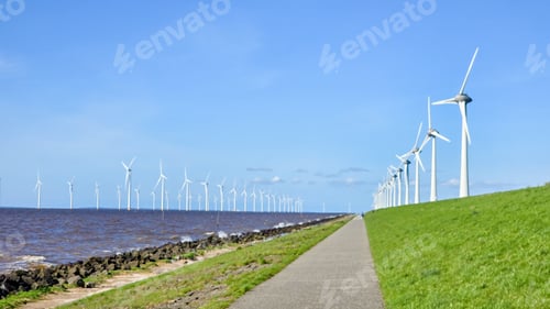 Preview: offshore windmill park and a blue sky, windmill park in the ocean. Netherlands Europe