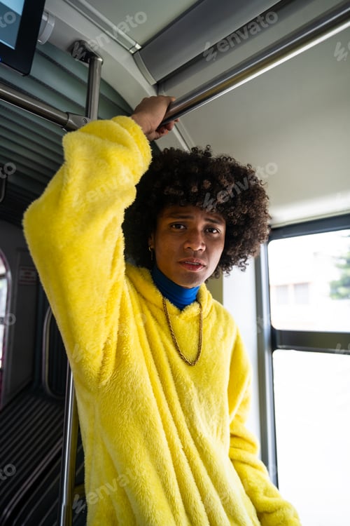 Preview: Portrait of a young afro mexican man traveling on the electric bus in Mexico City