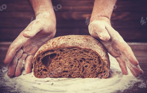 Preview: Baker's hands with a bread.