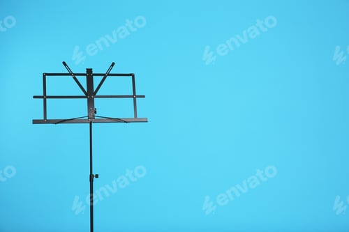Preview: Empty music note stand on color background. Space for text