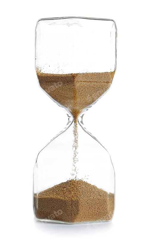 Preview: Hourglass with flowing sand on table against white background. Time management