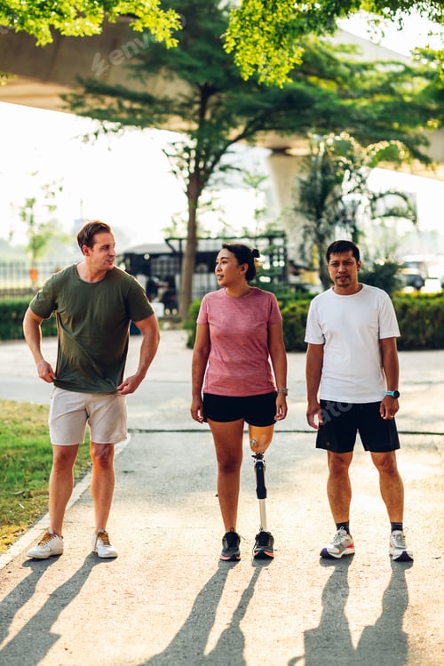Preview: Friend support Friend with a prosthetic leg while exercising outdoor.
