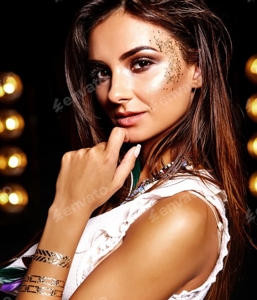 Preview: Portrait of young brunette woman posing in studio