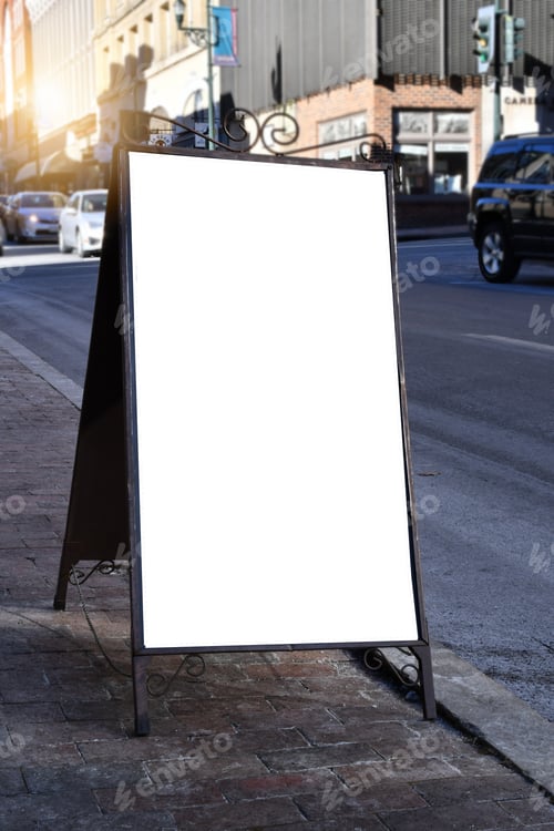Preview: Blank white mock up sign on sidewalk in historic downtown with copy space, text overlay, vertical