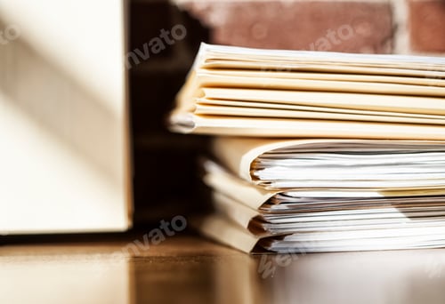 Preview: Close-up of files and file folders on a desk top in an office.