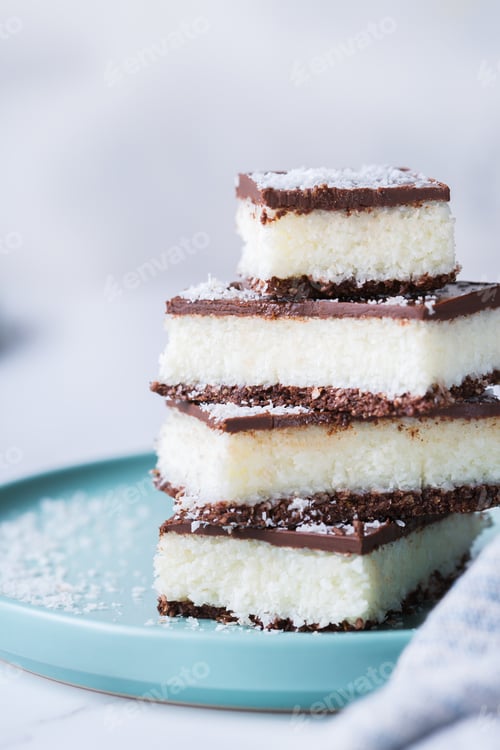 Preview: Organic raw vegan coconut bars with chocolate on kitchen table