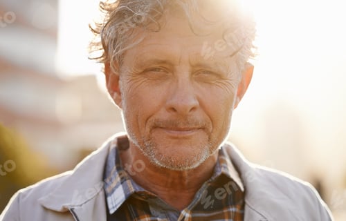 Preview: I live my life proudly. Portrait of a friendly-looking middle aged man outside.