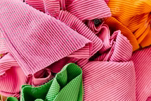 Preview: Image featuring an array of various-sized and colored fabrics