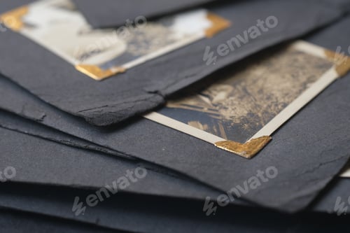 Preview: close up of Old photos bunch on black