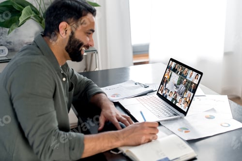 Preview: Brainstorming, briefing, business webinar. Smart man sit at a table, uses laptop, listens to a