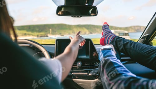 Preview: Young couple traveling by car feet up barefoot