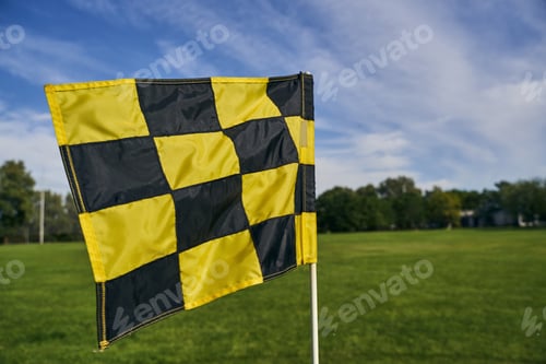 Preview: Black and yellow flag fluttering in the wind